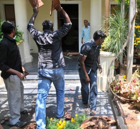Members of the Periyar Dravidar Kazhagam damage flower pots in the Sri Aurobindo Ashram in Puducherry on Thursday. Photo: T. Singaravelou. Photo Courtesy: The Hindu.
