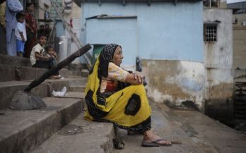 A woman sits alone while waiting for the celebrations on the first day of Ganesh Chaturthi at a temple in Karachi. Pic.: Insiya Syed/Reuters