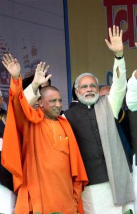 Yogi Adityanath with BJP prime ministerial candidate Narendra Modi recently - Pic. PTI. 