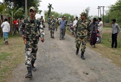 Indian security personnel patrol the attack-hit area of the Balapara village in the northeastern Indian state of Assam May 2, 2014. CREDIT: REUTERS/STRINGER