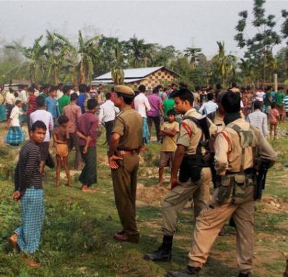 Security personnel at Narsingbari in Baksa district of Assam where some people were killed by militants on Friday. Pic. PTI.