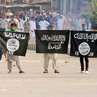 Masked men displaying ISIS and Al Qaeda flags in Srinagar after Eid Namaz on 29 th July, 2014.