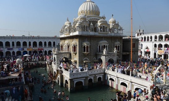 In this photograph taken on April 14, 2015, Pakistani and Indian Sikh devotees gather at the Gurdwara Panja Sahib during the annual Baisakhi festival in Hasanabdal. — AFP